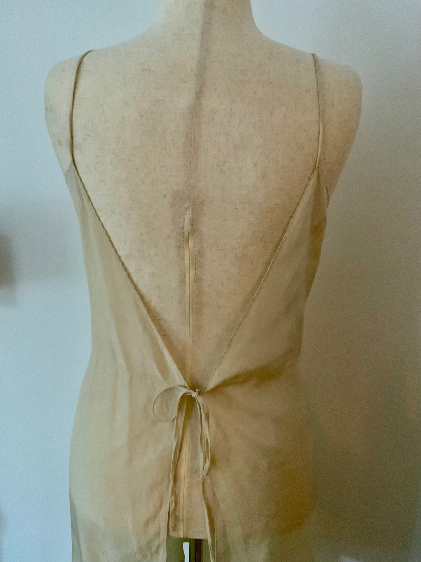 Antique silk lingerie slip, circa 1918–1922, featuring rare open-back drawstring construction and hand-embroidered bust panels- 20AR